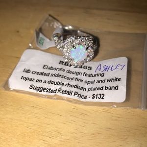 Size 8 fire opal center stone with white topaz